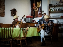 Local Mexican musicians enjoy their music in a restaurant in the old part if Sahagun, Mexico